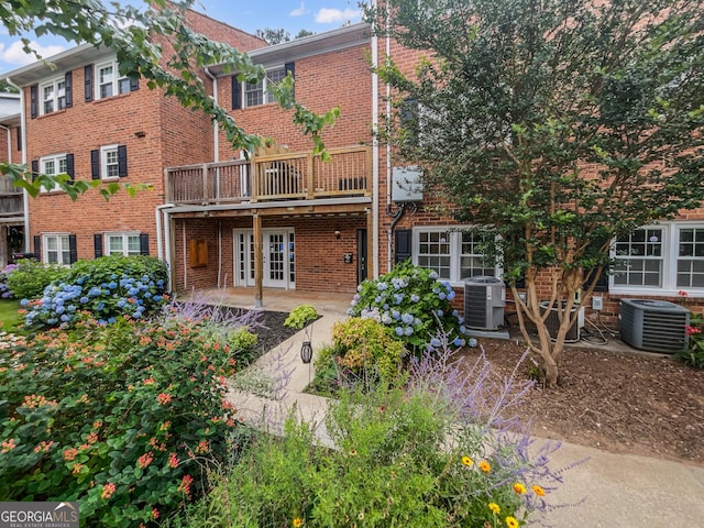 back of house with french doors, a patio area, and central air condition unit