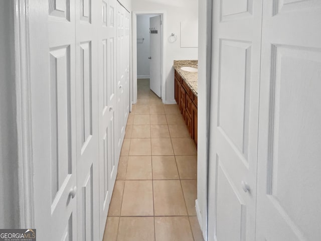 bathroom with tile patterned flooring and vanity