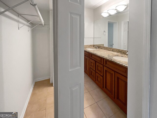 bathroom with tile patterned flooring and vanity