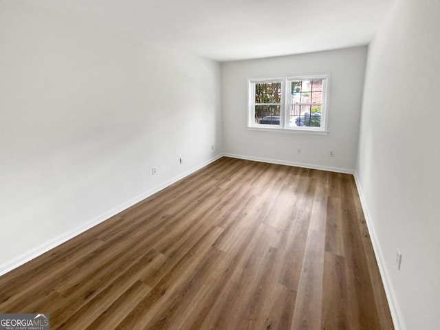 empty room featuring wood-type flooring