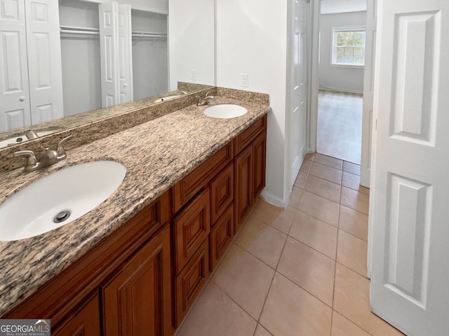 bathroom featuring tile patterned floors and vanity