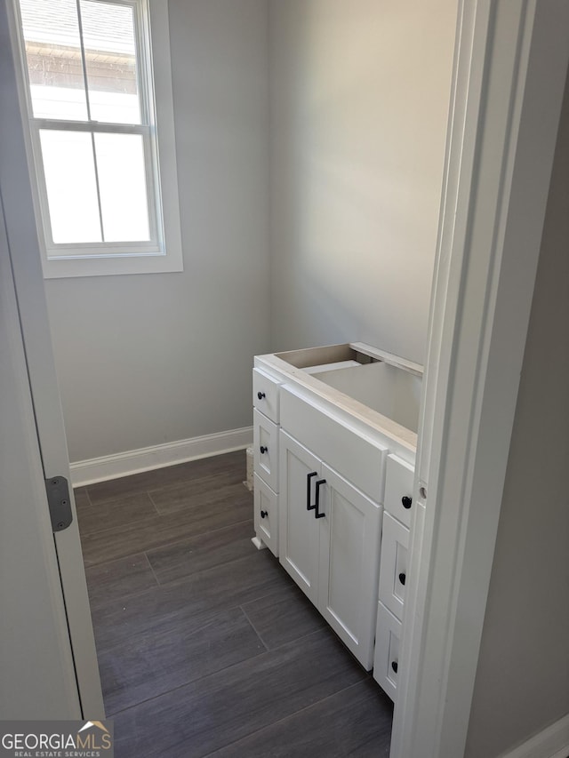 bathroom with hardwood / wood-style floors and vanity