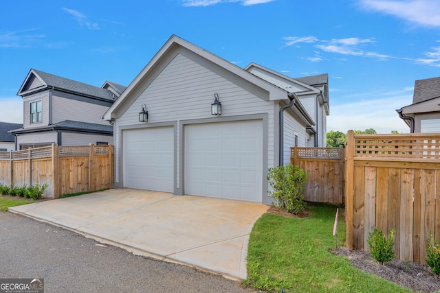 exterior space with a garage and an outdoor structure