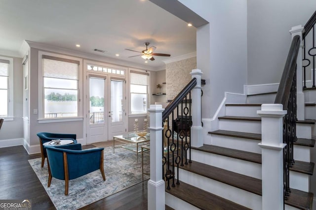 foyer entrance featuring ornamental molding, ceiling fan, and dark hardwood / wood-style flooring