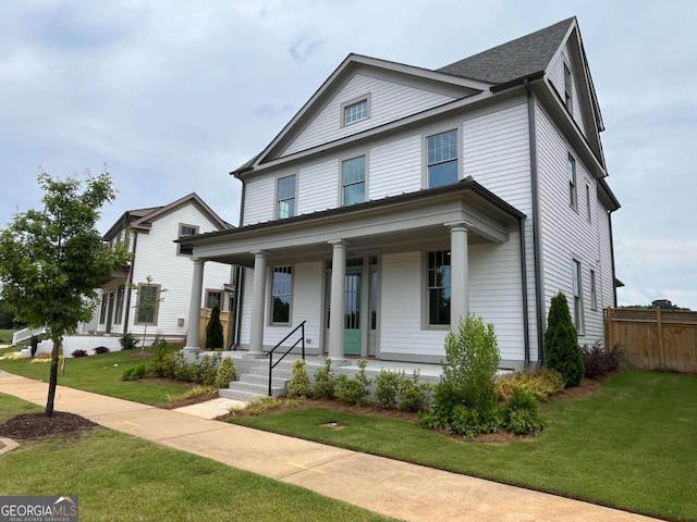 view of front of house featuring a front lawn and a porch