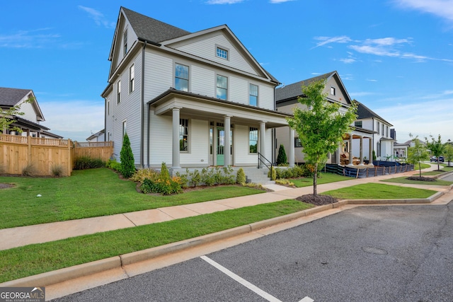 view of front of house with a front lawn and a porch