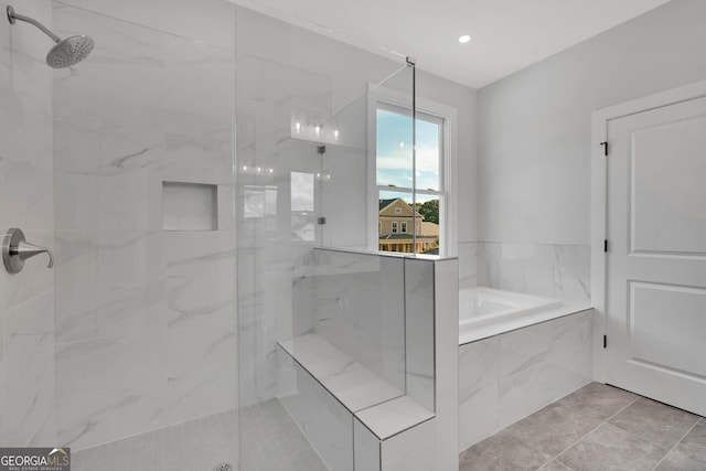 bathroom with plus walk in shower and tile patterned flooring