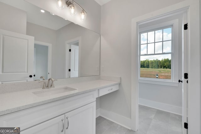 bathroom with tile patterned flooring and vanity