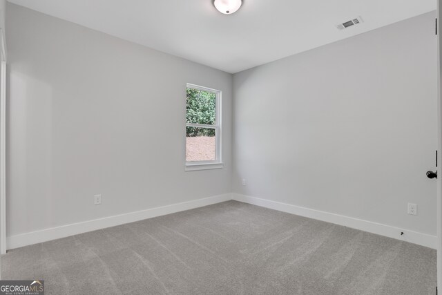 empty room featuring carpet