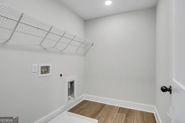 laundry room featuring hookup for a washing machine, wood-type flooring, and hookup for an electric dryer