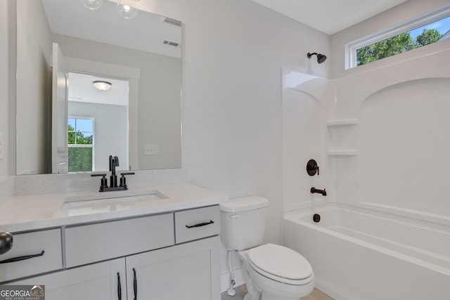 full bathroom featuring bathtub / shower combination, vanity, and toilet