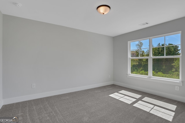 empty room featuring carpet flooring