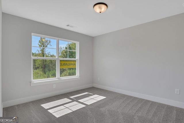 empty room with carpet flooring