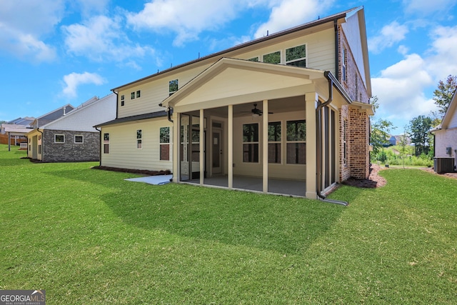 rear view of house with a lawn, ceiling fan, central AC, and a patio area