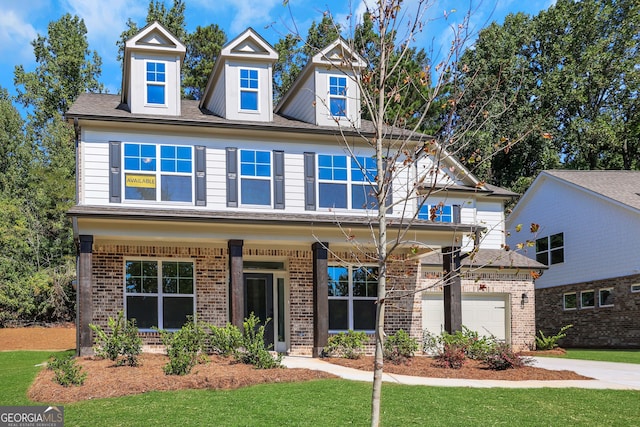 view of front facade featuring a front lawn and a garage