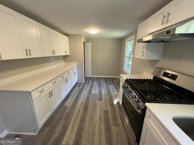 kitchen with white cabinets, dark hardwood / wood-style floors, and stainless steel gas range oven