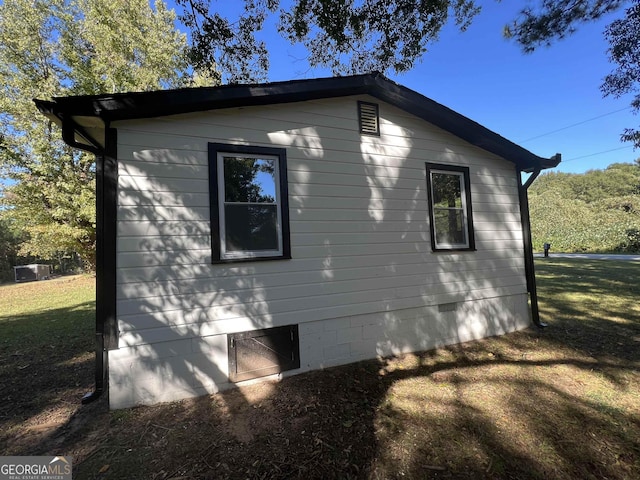 view of property exterior with a yard