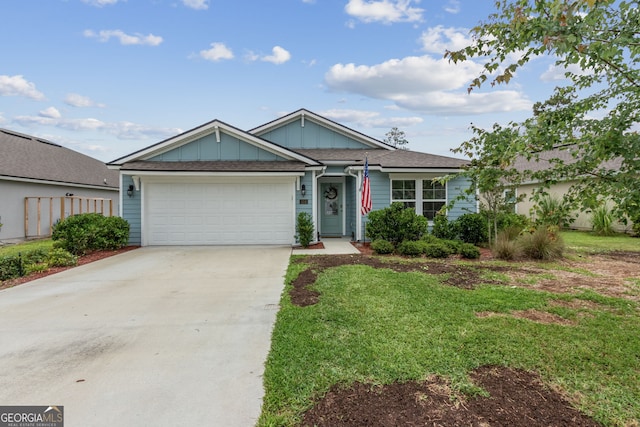 view of front of home with a garage and a front yard