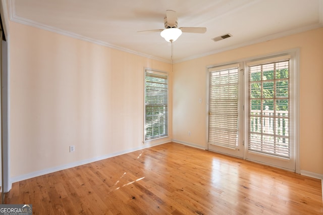 spare room featuring ceiling fan, plenty of natural light, and light hardwood / wood-style floors