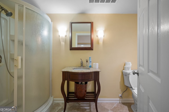 bathroom featuring tile patterned flooring, an enclosed shower, toilet, and vanity