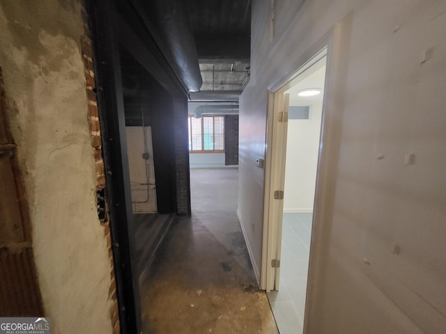 hallway featuring concrete flooring