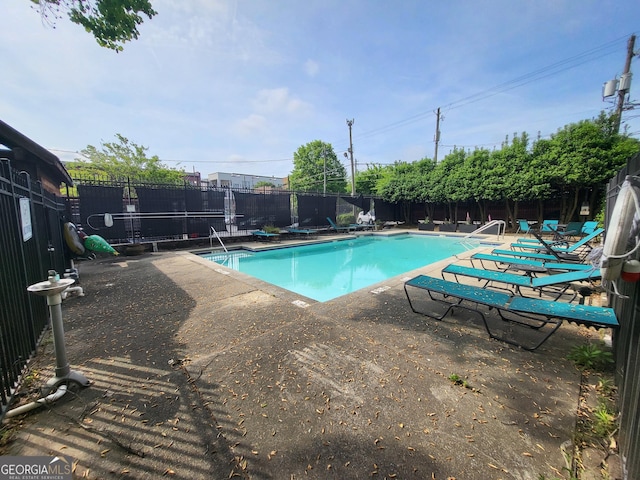 view of swimming pool featuring a patio