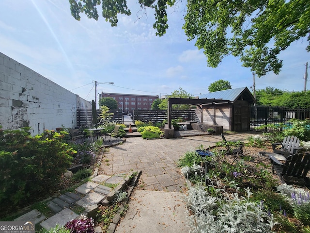 view of patio / terrace with an outdoor structure