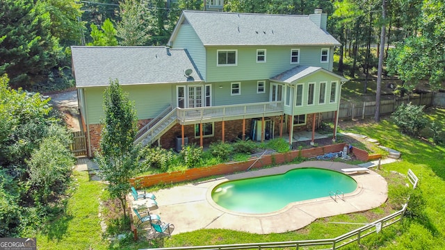 back of property with a yard, a fenced in pool, a patio area, and cooling unit