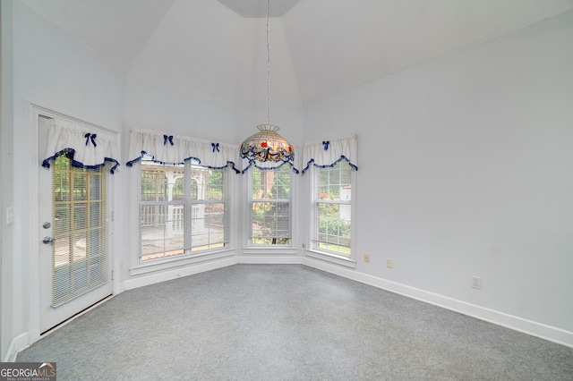 unfurnished room featuring high vaulted ceiling