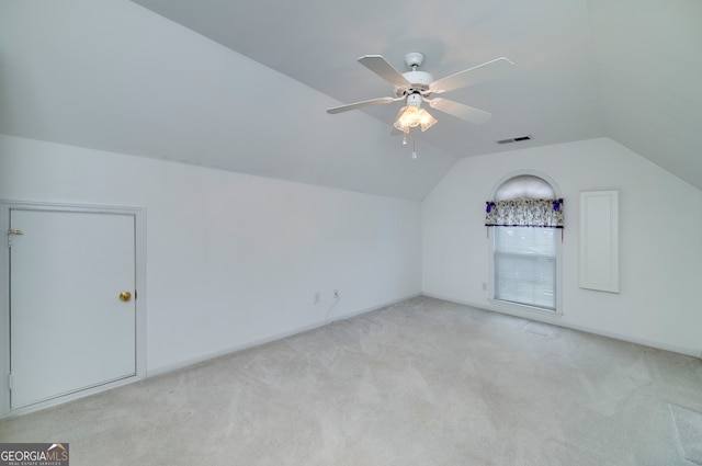 bonus room featuring light colored carpet, lofted ceiling, and ceiling fan