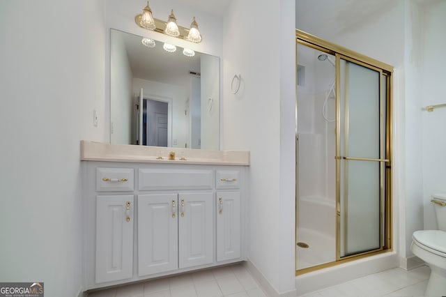 bathroom featuring tile patterned flooring, toilet, walk in shower, and vanity