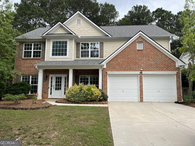 view of front facade featuring a front yard and a garage