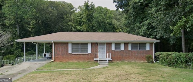 view of front of property featuring a carport and a front lawn