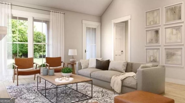 sitting room featuring light hardwood / wood-style flooring and vaulted ceiling