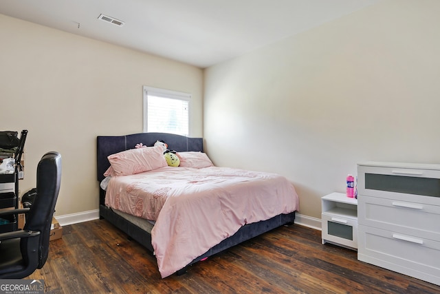 bedroom featuring dark wood-type flooring