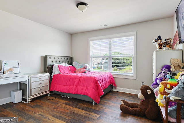 bedroom featuring dark hardwood / wood-style flooring