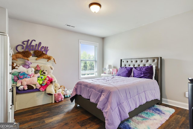 bedroom featuring dark hardwood / wood-style floors