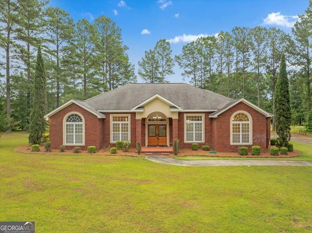 single story home featuring a front yard