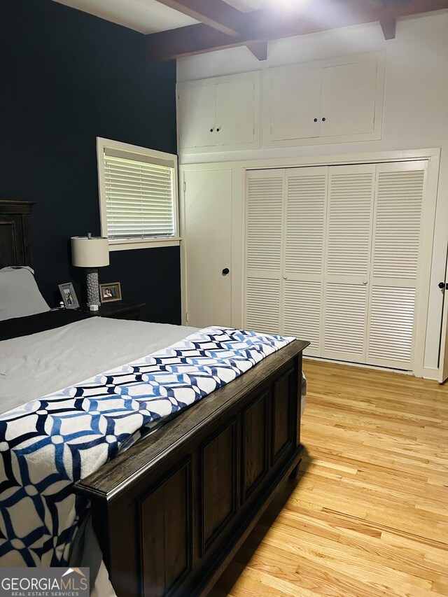 bedroom featuring a closet and light hardwood / wood-style flooring