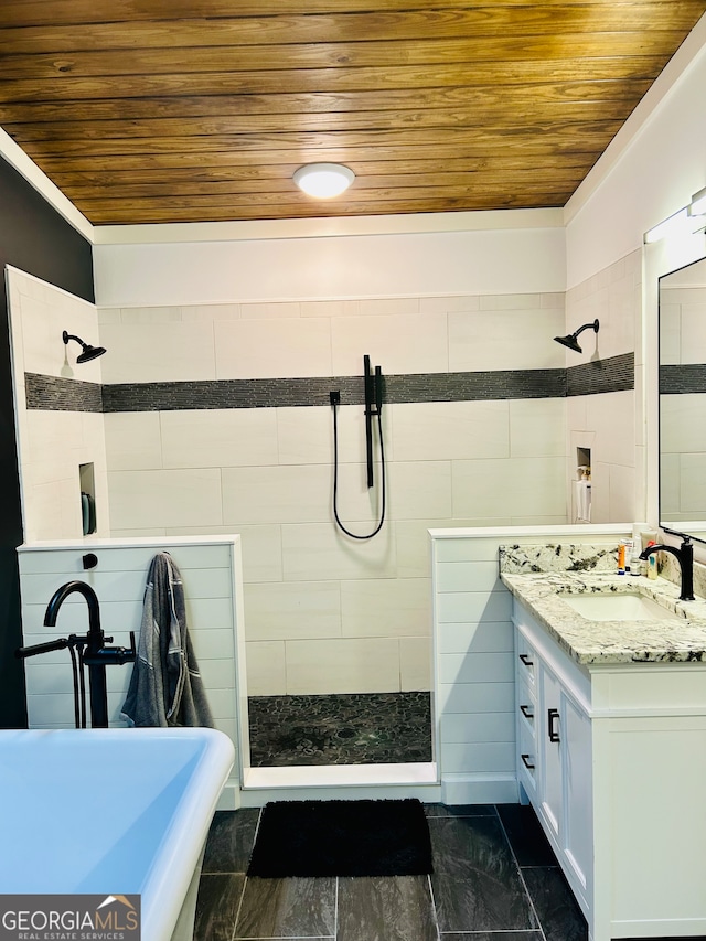 bathroom featuring a tile shower, tile flooring, oversized vanity, and wooden ceiling