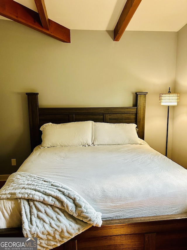 bedroom with beamed ceiling