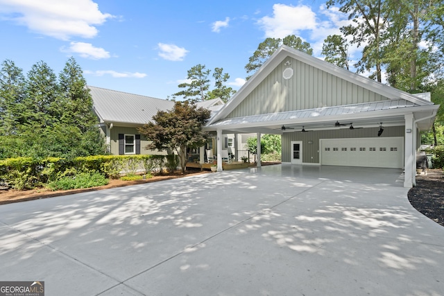 view of front facade featuring a garage and a carport