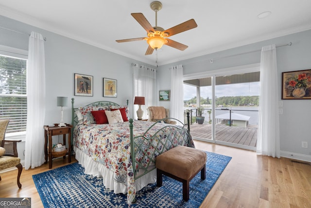 bedroom with ceiling fan, access to exterior, light hardwood / wood-style flooring, and ornamental molding