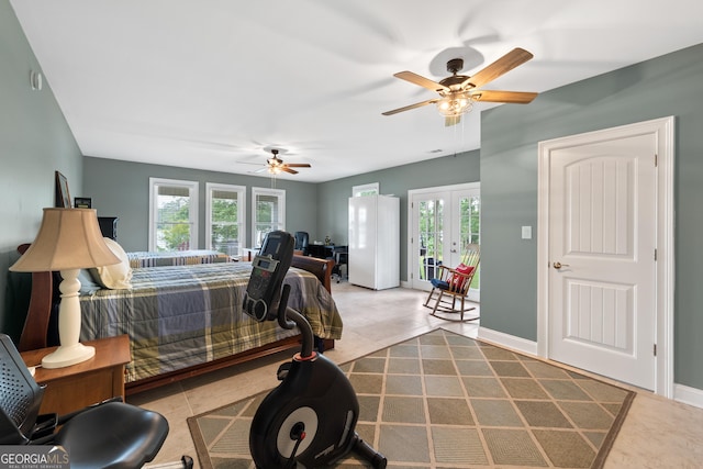 tiled bedroom with ceiling fan, french doors, access to outside, and multiple windows