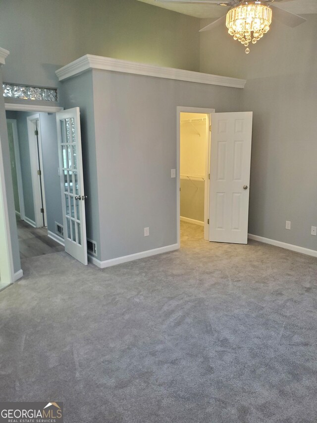 spare room featuring a textured ceiling and light colored carpet