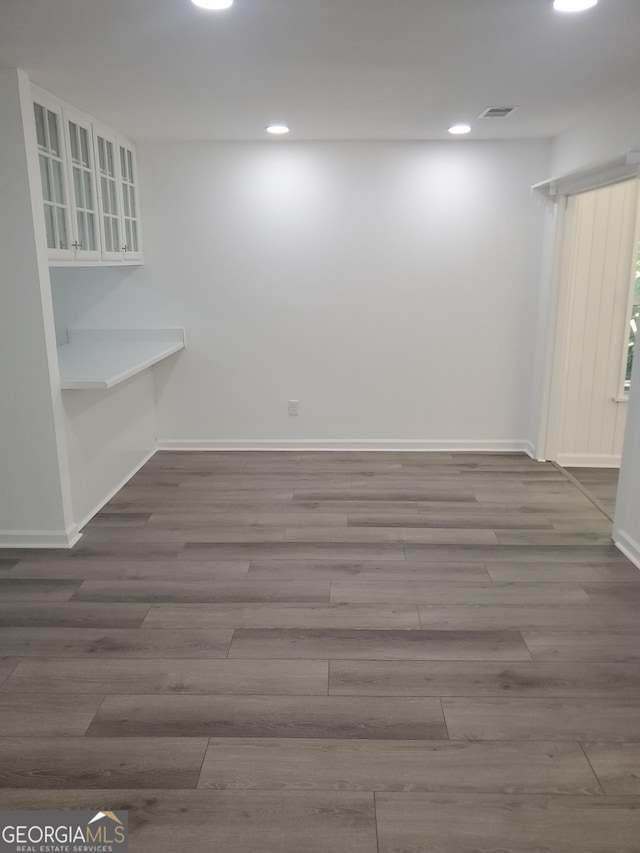 empty room with hardwood / wood-style floors