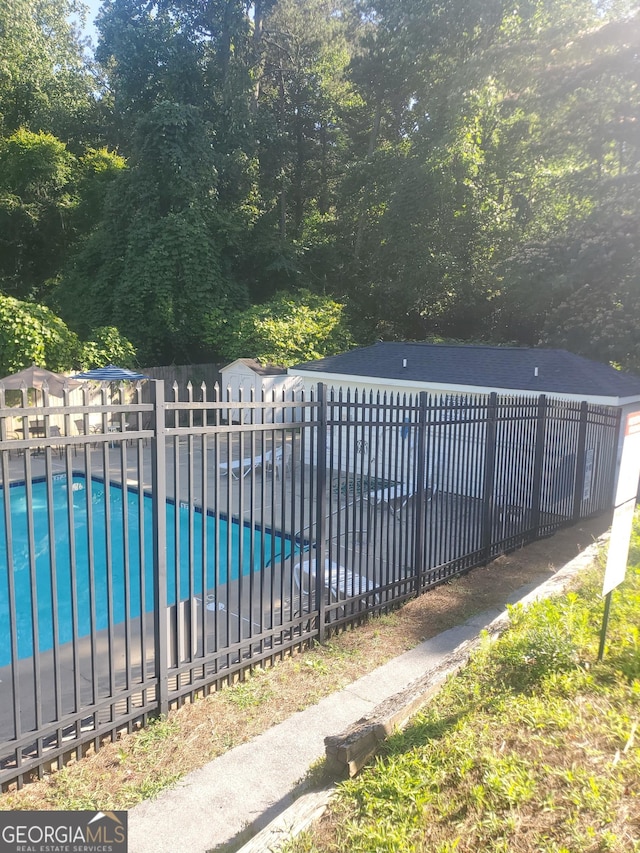 view of swimming pool featuring a patio area