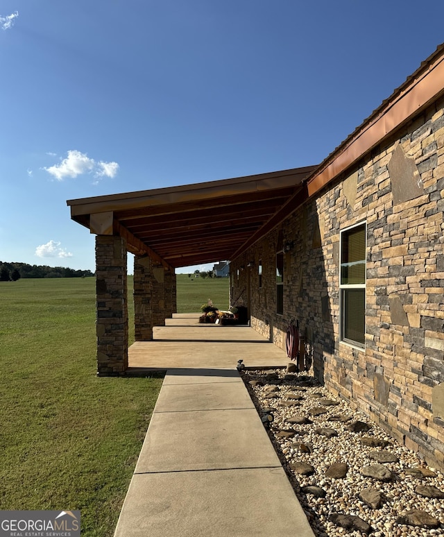 view of patio / terrace with a rural view