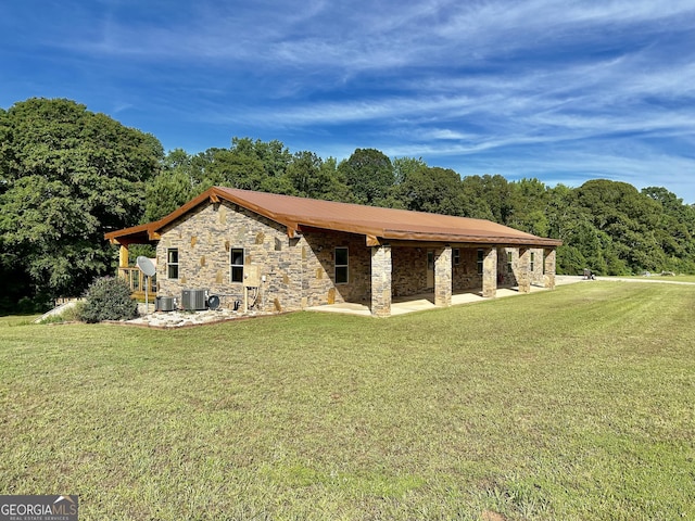 view of property exterior with a yard, a patio area, and central air condition unit