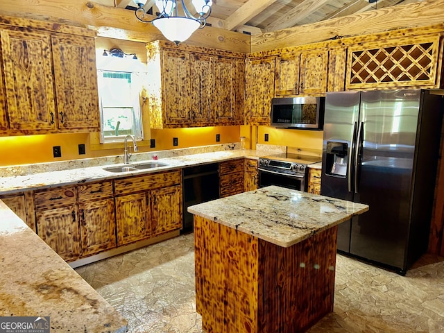 kitchen featuring light stone counters, a center island, sink, and stainless steel appliances